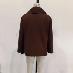 Back view of a short dark brown wool coat with a thick texture and loose-fitting design