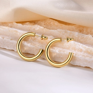 Minimalist thick gold C-shape hoop earrings in polished stainless steel for women