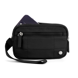 Detail of a black quilted wristlet pouch with zipper showing smartphone storage capacity