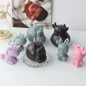 Collection of cute cartoon animal scented candles featuring unicorn, bull and hippo shapes
