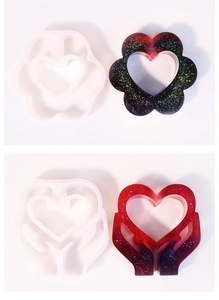Macro detail of heart-shaped silicone molds and glitter resin vase crafts for DIY decor