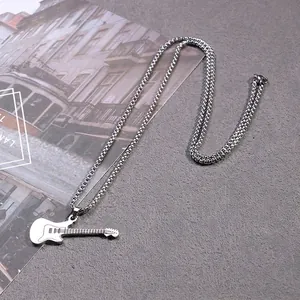 Men's stainless steel guitar pendant necklace with 70cm chain on stone background