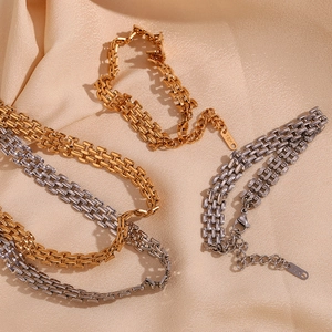 Detail of 18K gold and silver plated woven mesh chain strap with secure lobster clasp
