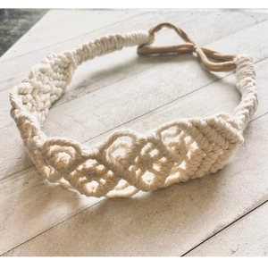 Handmade bohemian ivory cotton woven headband featuring intricate knot patterns on wood back