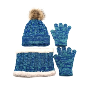 Kids' winter knit set featuring a pom-pom hat, fleece-lined neck warmer, and gloves