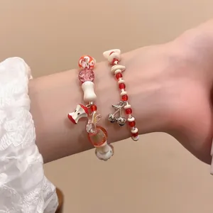 Beaded bracelets set with apple and cherry pendants featuring ceramic and crystal beads