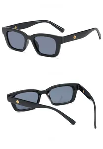Three views showing the black frame sunglasses with golden rivets and grey lenses