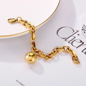 Golden stainless steel chain bracelet with large hollow sphere charm and lobster clasp
