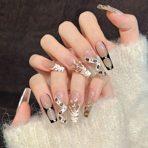 Handmade leopard print press-on nails with 3D floral accents and silver rhinestones