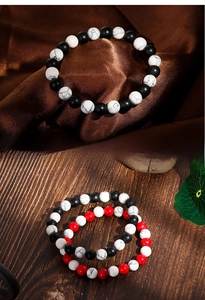 Detailed view of 8mm agate and turquoise beaded elastic bracelets with marble patterns