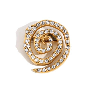 18K gold plated stainless steel swirl brooch with micro-paved white crystals on white background