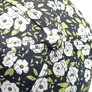 Close-up of blue floral baseball cap top showing cotton twill texture and stitching