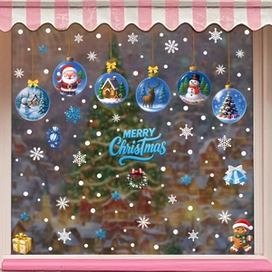 Christmas window stickers with blue snow globe designs and Merry Christmas lettering