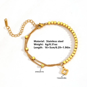 Double-layered gold stainless steel bracelet with clover pendant and bead details