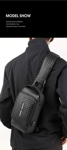 Detailed view of men's black woven leather sling bag with external USB charging port