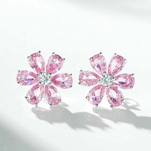 Close-up of flower stud earrings with pink pear-cut crystals and silver setting