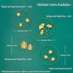 Set of four gold metal wall decorations with ginkgo and maple leaf motifs in 24cm circles
