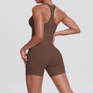 Detail view of racerback tank top and high waist shorts showing brown athletic fabric texture