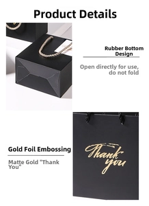 Detail of matte black paper gift bag with gold Thank You foil and twisted rope handles