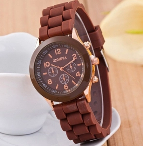 Detail of Geneva quartz watch with brown silicone strap and crystal-studded rose gold dial