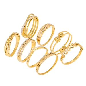 8-piece gold stainless steel bracelet set with hollow weave and zircon textures