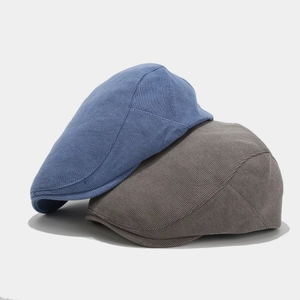 Minimalist knit cotton beret hats in grey and blue with detailed woven texture