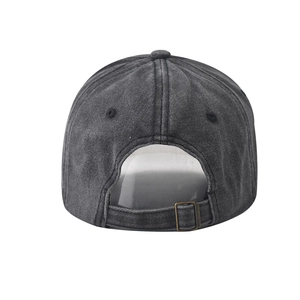 Detail view of washed grey baseball cap back with adjustable bronze metal buckle
