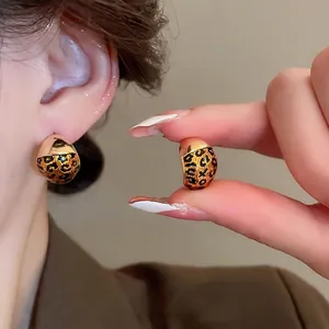 Gold-plated leopard print geometric stud earrings in a vintage half-sphere design