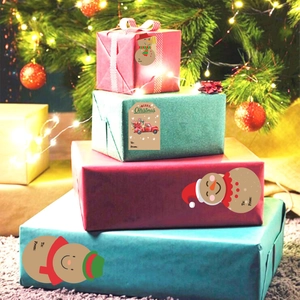 Merry Christmas gift stickers with snowman and vintage truck designs on holiday boxes