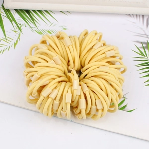 Detail of high-elasticity pale yellow hair ties with matching plastic rectangle buckles