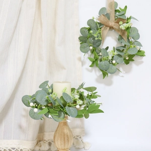 Artificial eucalyptus wreath candle ring with white berries and burlap bow for home decor