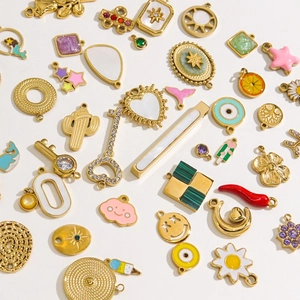 Baroque heart and star charms with zircon inlays in gold stainless steel finish