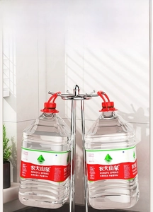 Rotating kitchen utensil rack with silver hooks showing heavy duty load bearing capacity