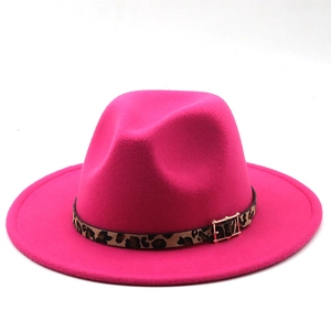 Detail of rose red fedora hat with leopard print band and gold metal buckle