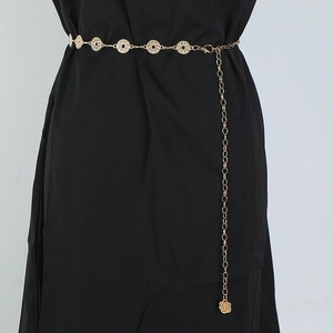 Detail of gold metal chain belt with rhinestone circles and a rose flower pendant charm