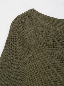 Detailed macro view of olive green knit texture and neckline seams on the top