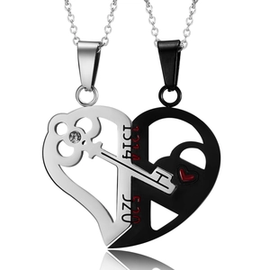 Detail of couple necklaces showing a key and lock heart puzzle with 1314 520 engravings