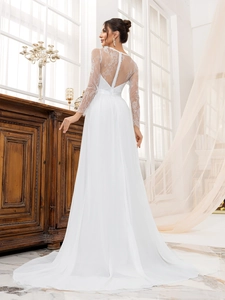 Elegant white lace long sleeve wedding dress with a buttoned back and long tulle train