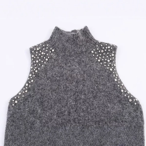 Grey wool blend knit top with luxury rhinestone beaded shoulders and high collar
