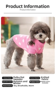 Detail showing pink knitted dog sweater with white polka dots for autumn and winter warmth