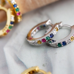 Detailed close-up of S925 sterling silver hoop earrings with micro-set colorful zircons