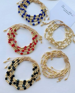 Set of five colorful layered beaded bracelets with faceted glass and adjustable cords