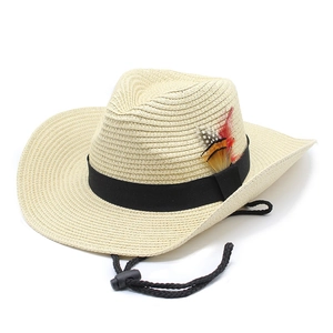 Detail of straw cowboy hat with 9cm wide brim, ethnic feather trim and windproof cord