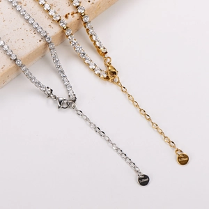 S.Steel tennis necklace with cubic zirconia in gold and silver finish on stone