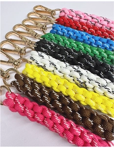Detail of colorful hand-woven nylon paracord keychains with gold metal lobster clasps