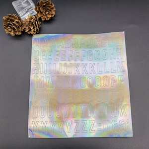 Holographic laser alphabet stickers showing A-Z uppercase letters on a dark background