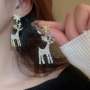 Sparkling snowflake and reindeer earrings with festive gold and red pearl details
