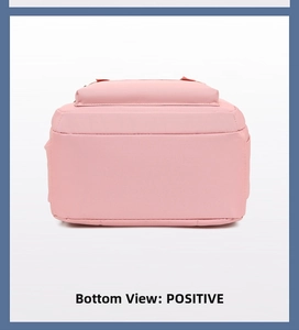 Detailed bottom view of pink waterproof nylon backpack showing flat base and durable stitching