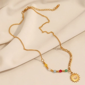 Detail of 18K gold-plated stainless steel sun pendant necklace with multicolor beads