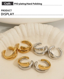 Detail of PVD plated 316 stainless steel ear cuffs with hand polishing on a shell tray